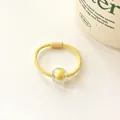 Elastic yellow hair tie with a candy-colored clear acrylic bead for kids' ponytails - Yellow