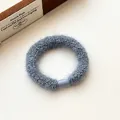 Thick elastic blue-grey plush hair tie with soft knit texture and durable plastic clasp - Blue