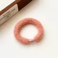 Pink-orange plush elastic hair tie with soft fuzzy texture and seamless plastic buckle - Pink