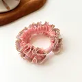 Pink lace hair scrunchie with metallic gold trim and matching fastening cylinder - Pink