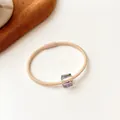 Elastic beige hair tie featuring a square faceted iridescent crystal bead decoration - Beige