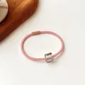 Pink high elasticity hair tie with clear geometric crystal bead on white background - Pink