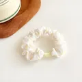 Polka dot scrunchie in white with yellow spots and a small yellow plastic fastener - Yellow