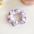 Light purple scrunchie with dark purple edges and white floral pattern - Purple