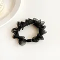 Black organza scrunchie with smooth oval bead accent for elegant ponytail styling - Black