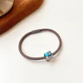 Brown high-elastic hair tie featuring a blue-purple iridescent crystal cube ornament - Gray