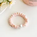 Elastic light pink pleated hair scrunchie with a large white pearl bead accessory - Bud Pink