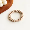 Melkkoffie contrast gevlochten elastische haarelastiek met minimalistische gesp - Beige