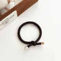 Dark brown high elasticity hair tie with knot design and gold metal end caps - Dark Brown