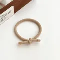 Light coffee elastic knotted hair tie featuring elegant gold metal end caps for women - Khaki
