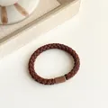 Brown braided hair tie with high elasticity and a matching cylindrical buckle detail - Brown