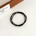 Drie-in-één zwarte elastische haarelastiek met gouden kralen in minimalistisch ontwerp - Zwart