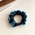 Polka dot hair scrunchie in black and blue with scalloped edges and a rectangle bead - Navy Blue