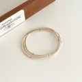 Élastique à cheveux perlé beige trois-en-un avec perles dorées et haute élasticité - Beige