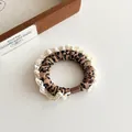Elegant leopard print hair scrunchie with lace trim and vintage brown buckle detail - Coffee