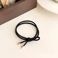 Elastic black double-loop hair tie with elegant gold metal tips for women - Black