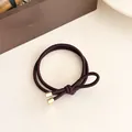 Coffee brown high elasticity hair tie with dual-strand braided design and gold metal accents - Dark Brown