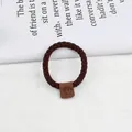 Brown woven hair scrunchie with a square leather smiley face patch for women - Dark Coffee