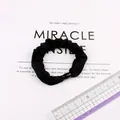 Elastic black fabric scrunchie with oval bead detail on display card with ruler - Black