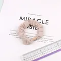 Beige elastic ice silk scrunchie with round bead detail shown with a measuring ruler - Beige