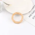 Elastic beige leopard print spiral phone cord hair tie on decorative ceramic plate - Light Yellow