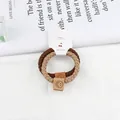 Lot de deux chouchous tressés en marron et beige avec étiquettes smiley en cuir - Khaki + Café