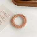 Matte peach pink spiral telephone wire hair tie with high elasticity for ponytails - Orange Pink