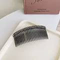 Crystal beaded hair comb in gunmetal finish with grey rhinestones on a cream tray - Gray