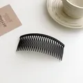 Matte black curved hair side comb clip with fine teeth for styling and flyaway hair control - Black