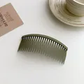 Minimalist olive green matte hair finishing comb with a curved non-slip design - Green