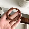 Thick dark brown high elasticity ribbed hair tie with reinforced matte joint wrap - Brown