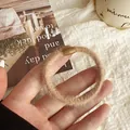 Plush milk coffee brown scrunchie with oval bead detail for gentle hair styling - Khaki