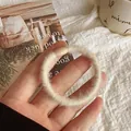 Plush cream hair scrunchie made of soft faux fur with high elastic hair tie band - Beige