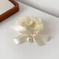 Elegant cream bow hair scrunchie with pearls and satin organza ribbons for women - Off White