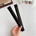 Dut-Macher-Tool aus schwarzem Satin mit flexiblem Metallkern für elegantes Haarstyling - Schwarz