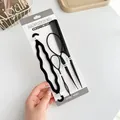 4-piece black hair styling tool set with topsy tail and comb on display card - 4 Piece Set (Hair Tail x2 + Comb + Braider) / Black