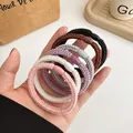 Set van 6 zeer elastische gevlochten haarelastiekjes in neutrale kleuren in hand - Willekeurig Gemengd
