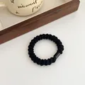 Thick black high-elastic hair tie with smooth resin buckle for versatile hairstyling - Black