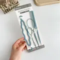 4-piece blue hair styling tool set with tail comb and hair loop tools on card packaging - 4 Piece Set (Hair Tail x2 + Comb + Braider) / Blue