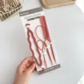 Pink 4-piece hair styling set with comb and loop tools on a white display card - 4 Piece Set (Hair Tail x2 + Comb + Braider) / Dusty Pink