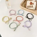 Set of 7 colorful bow elastic hair ties with gold metal ends on white background - Random Mixed