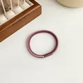 Coletero elástico trenzado en color púrpura oscuro y rosa pálido con un cierre cilíndrico - Rosa Palo