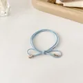 Hellblaues elastisches Haargummi mit Schleife und Metallenden für Pferdeschwanz - Blau