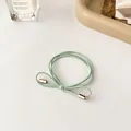 Light green high elasticity hair tie with a minimalist gold metal bow-shaped clasp - Green