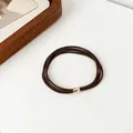 Elastic ponytail hair tie in coffee brown with a polished gold metal clasp - Dark Coffee