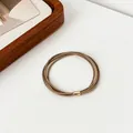 Elastic coffee brown multi-strand hair tie with a rose gold metal buckle fastener - Khaki