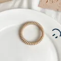 Elastic spiral phone cord hair tie in soft light khaki matte finish for women - Matte Nude
