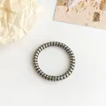 Coletero de espiral gris oscuro metálico estilo cable de teléfono para coletas sin marcas - Color gunmetal