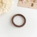 Coletero de espiral en bronce metálico con diseño flexible de alta elasticidad - Bronce