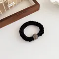 Elegant black velvet scrunchie with sparkling rhinestone ball detail for ponytails - Black